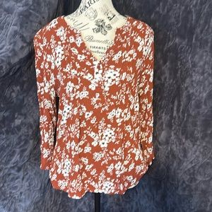 Rust colored shirt with flowers